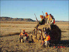 Pheasant Hunters on a Bail of Hay at Buffalo Butte Ranch. Heck of a hunt.