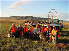 A group in 2003 at the lodge. Notice our early transportation in the background!?
